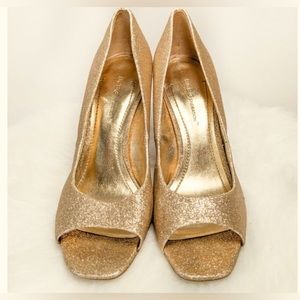 BCBGeneration “Ariel” Gold Peep Toe Pumps